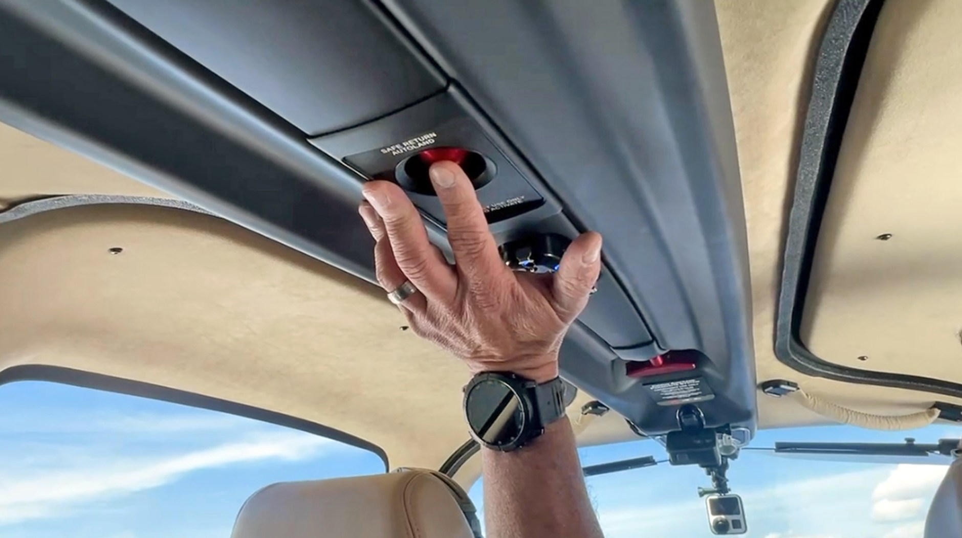 The Safe Return button is in the overhead “surfboard” where it’s accessible to anyone in the cabin.